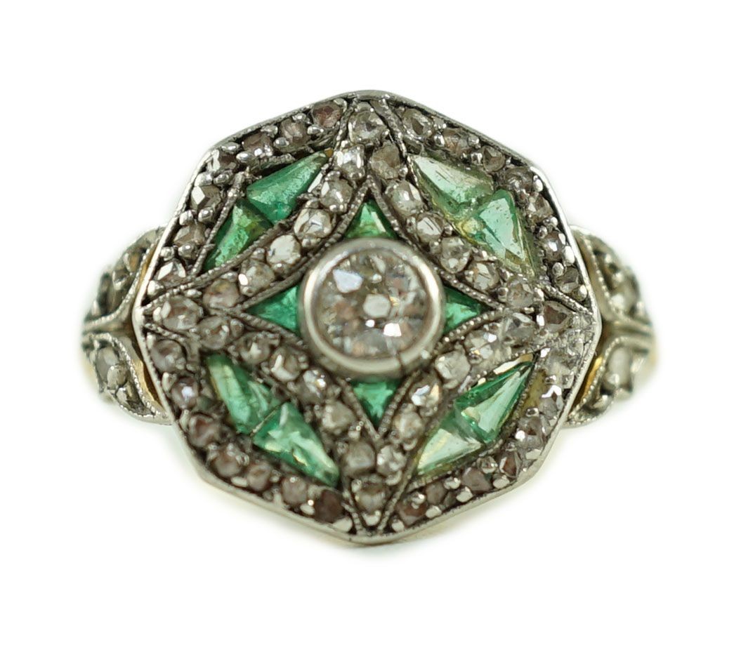 A Belle Epoque gold, emerald and diamond cluster set octagonal dress ring